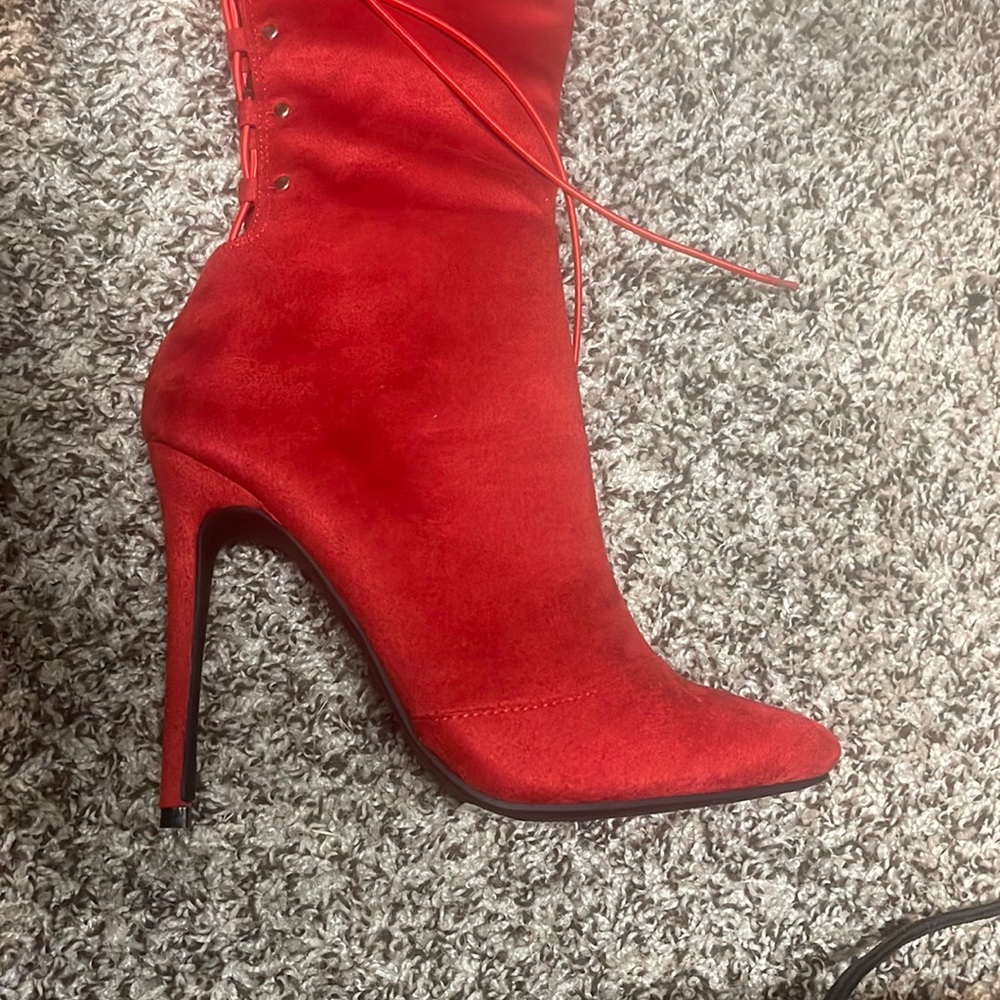 Long red boots with string. Perfect for a girls night out!